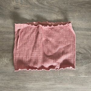 Pink strapless crop top with ruffles on top and bottom